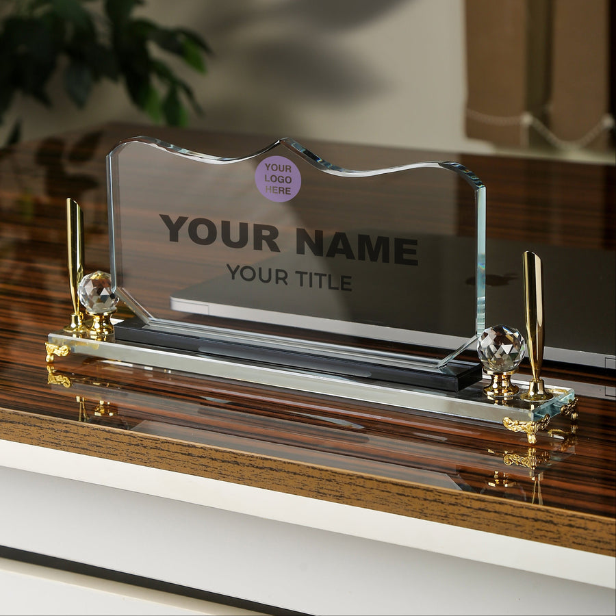 Decorative nameplate with gold accents on a wooden surface