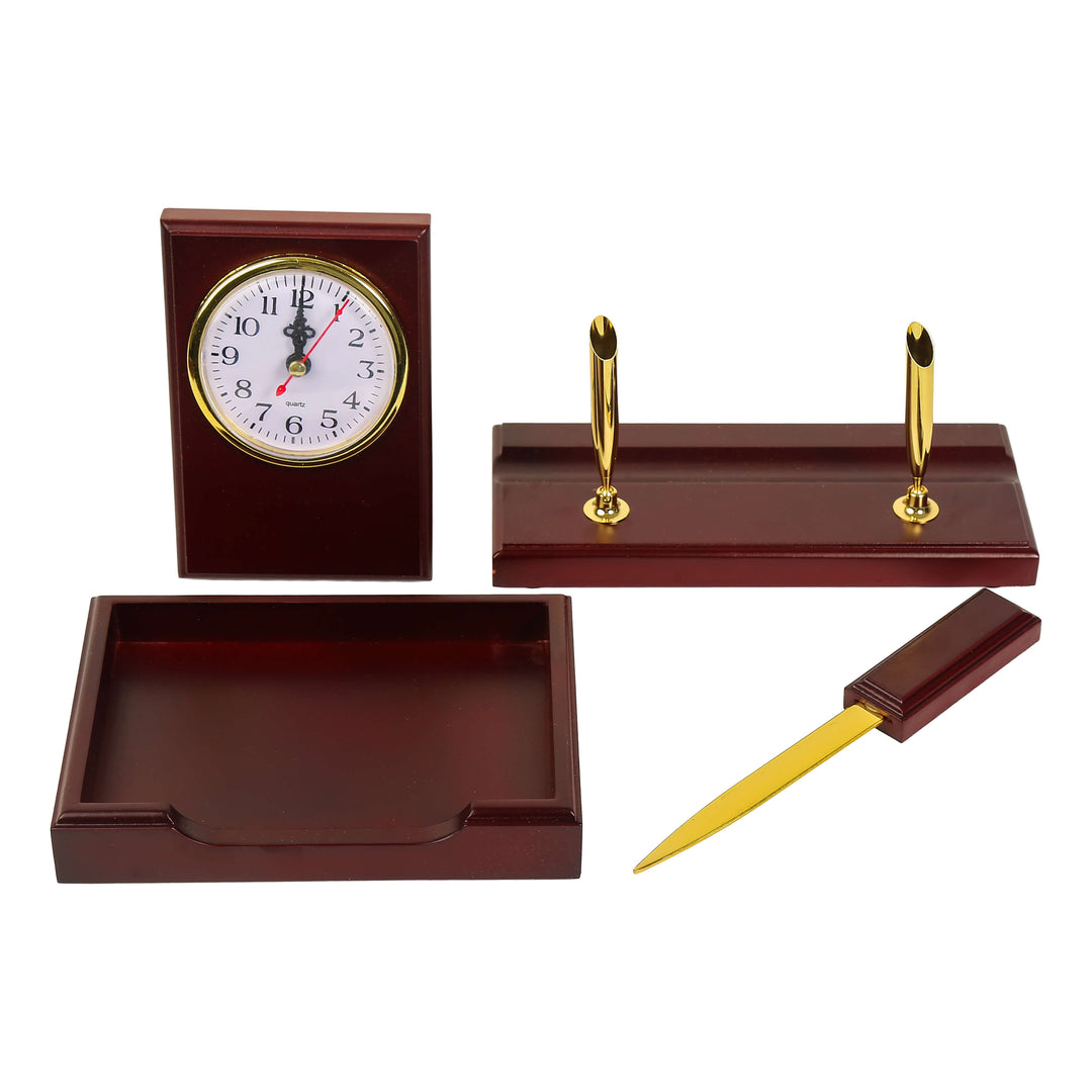 Wooden desk set with clock, letter opener, pen holders, and tray on a white background