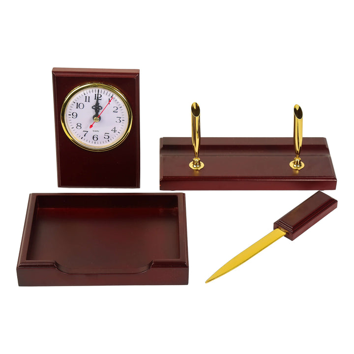 Wooden desk set with clock, letter opener, pen holders, and tray on a white background