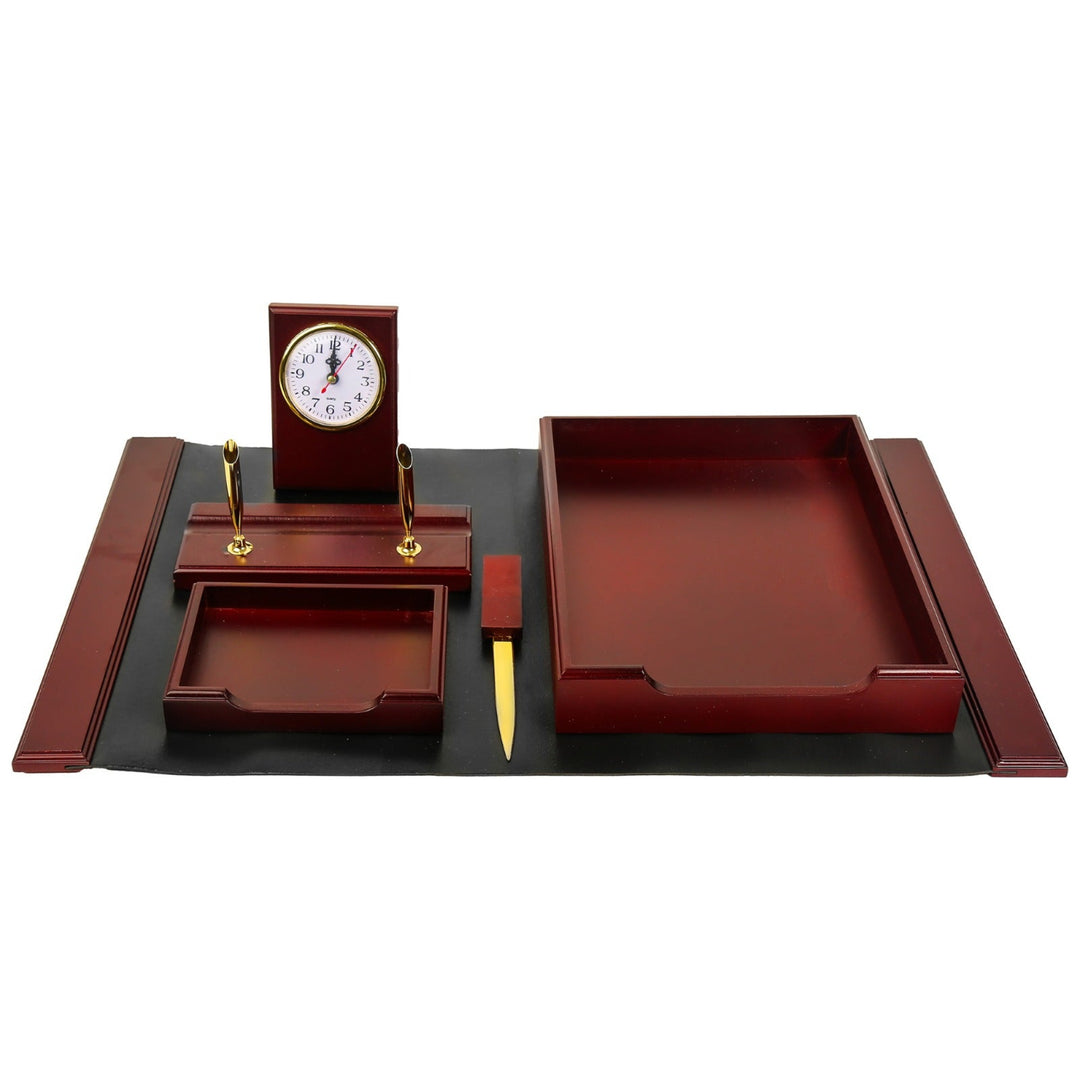 Wooden desk set with clock, pen holder, and tray on a white background