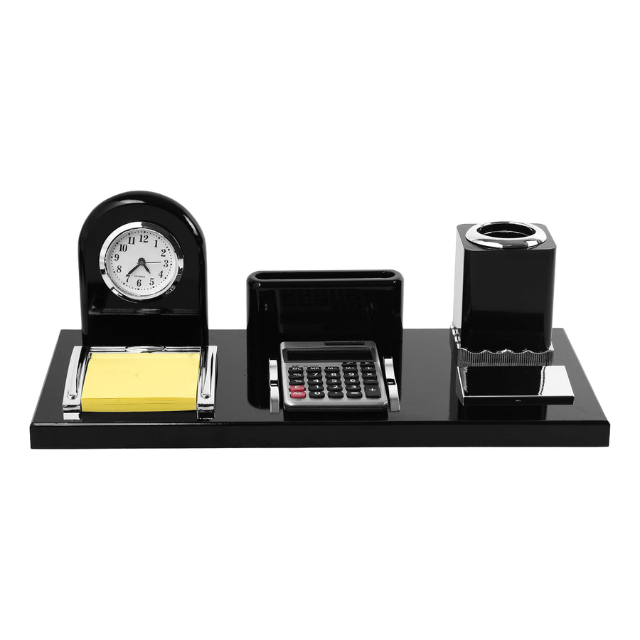 Black desk organizer with clock, calculator, and other items on a white background.