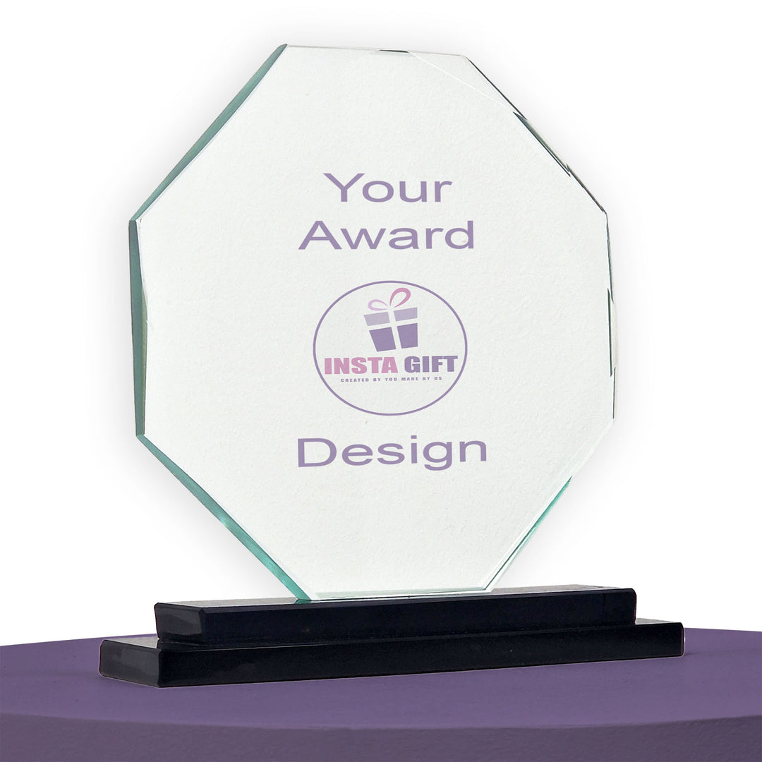 Clear glass award with 'INSTA GIFT' logo on a purple surface
