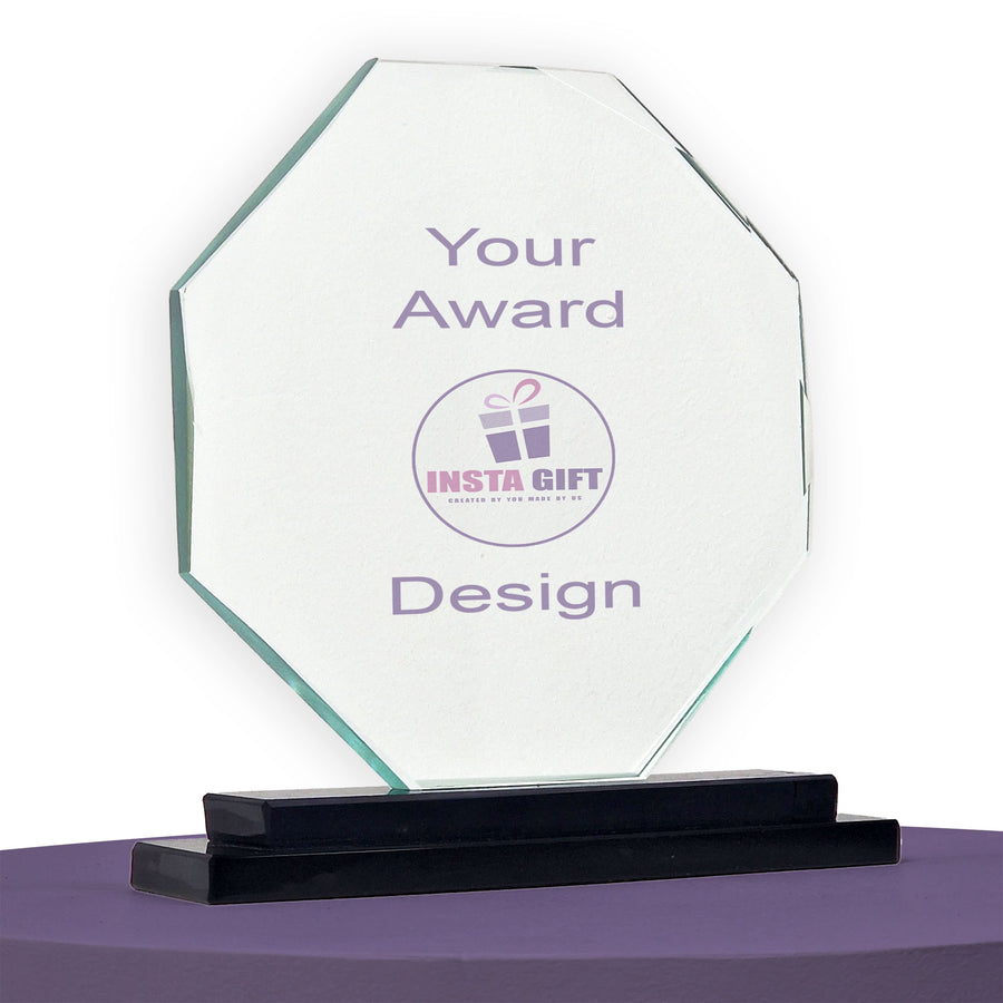 Clear glass award with 'INSTA GIFT' logo on a purple surface