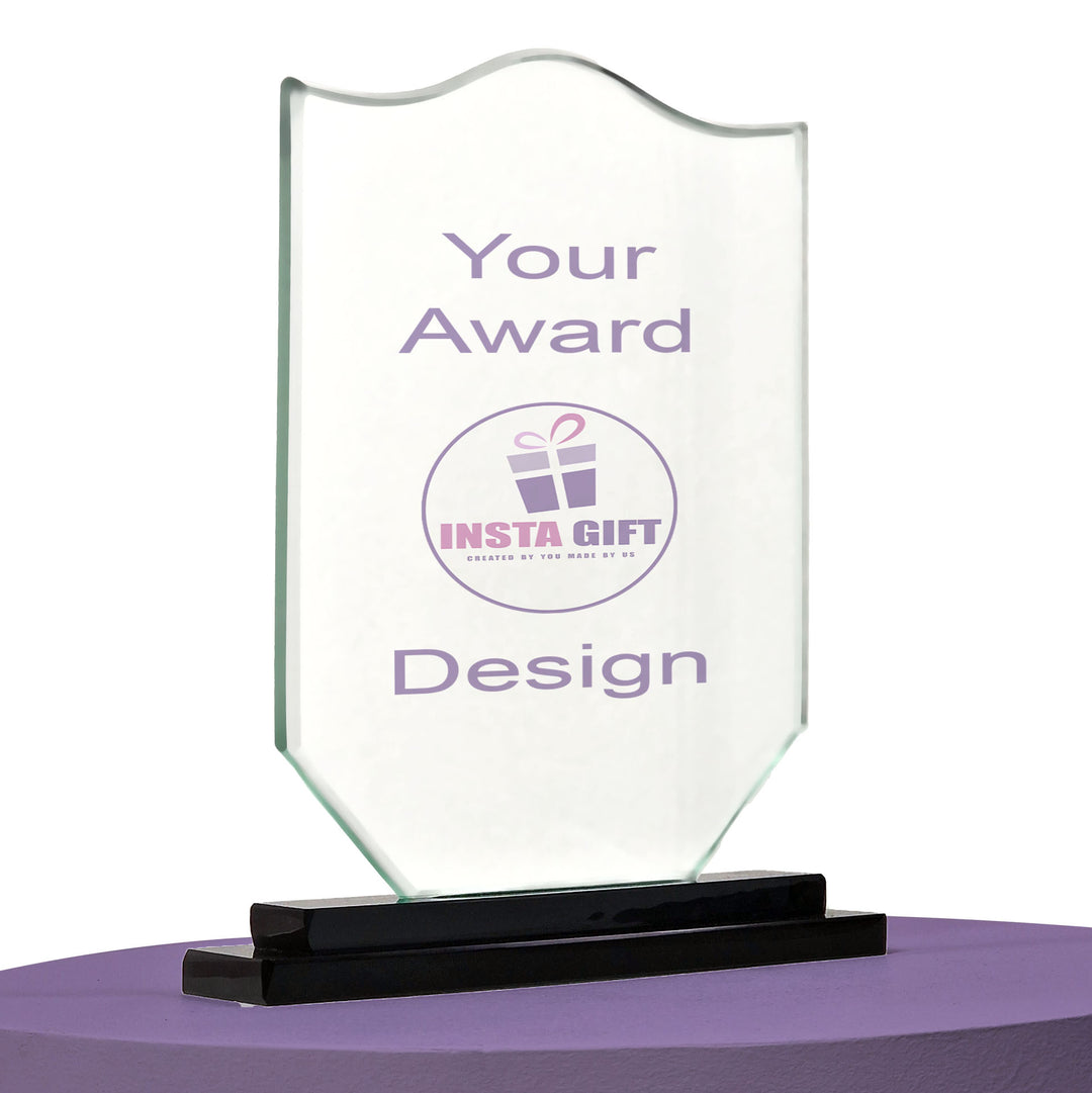 Clear glass award with black base on a white background
