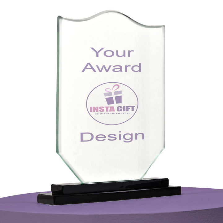 Clear glass award with black base on a white background
