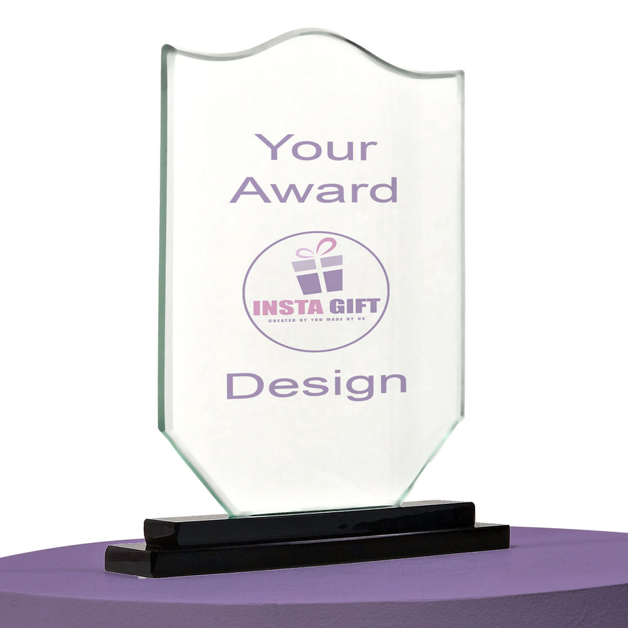 Clear glass award with black base on a white background