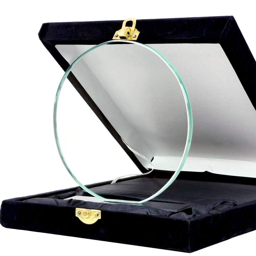 crystal circular award in a black display case with gold clasps on a white background