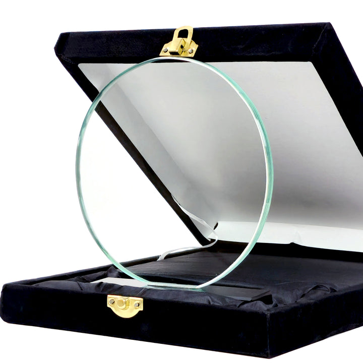 crystal circular award in a black display case with gold clasps on a white background