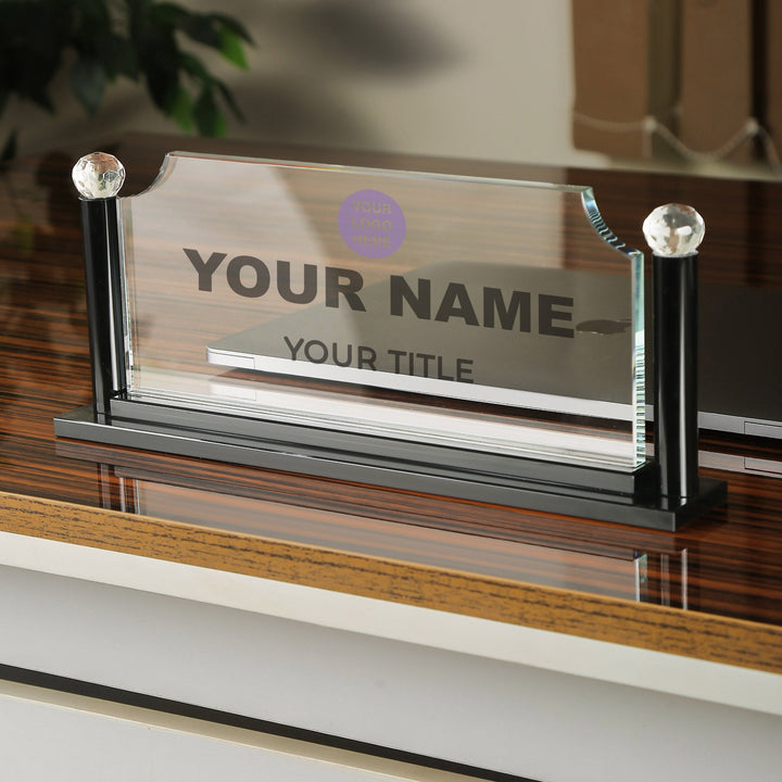 Personalized nameplate on a stand with customizable text, placed on a wooden surface.